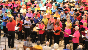 Singers wear bright, jewel colors during the popular Summer Rocks choral concerts that feature classic rock from the '60s and '70s.